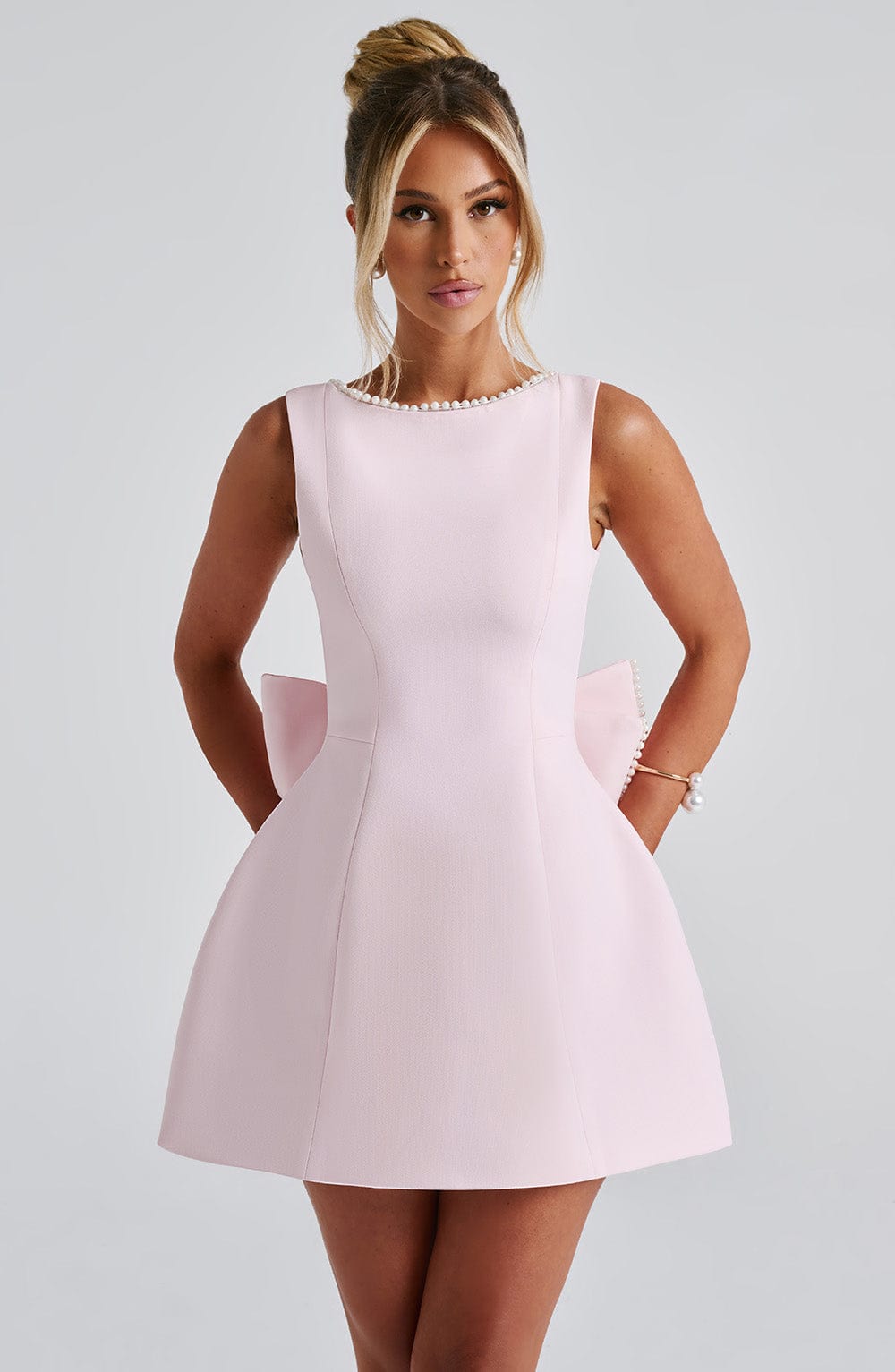 Yvonne | Structured mini dress with pearl neckline and bow