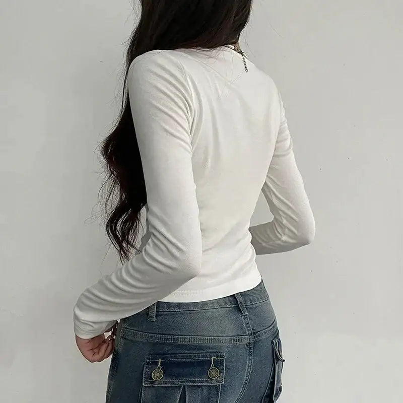 Flirty top with ruched bust, lace trim, and fitted cut