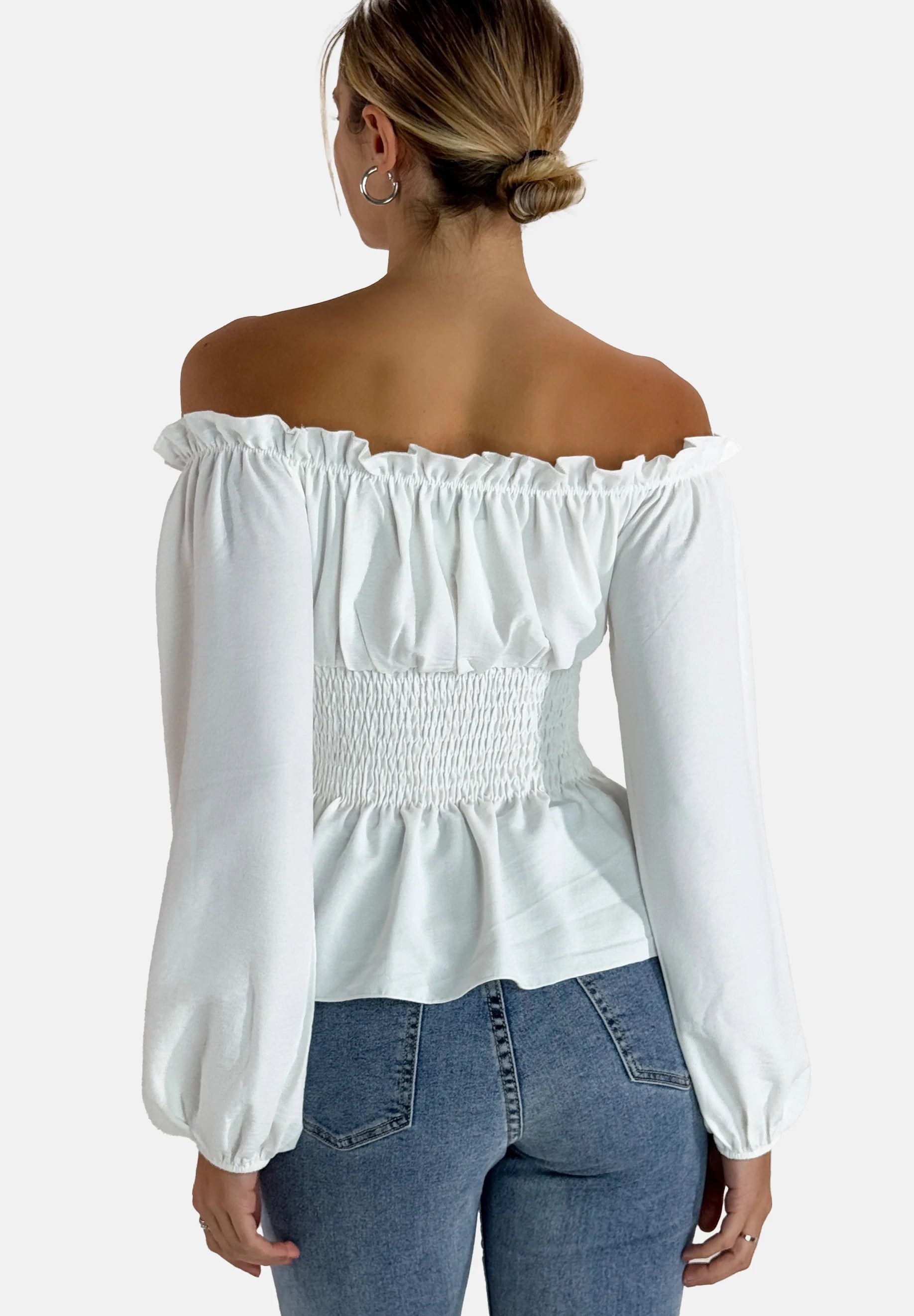 Flirty off-shoulder white smocked tops with a peplum aesthetic