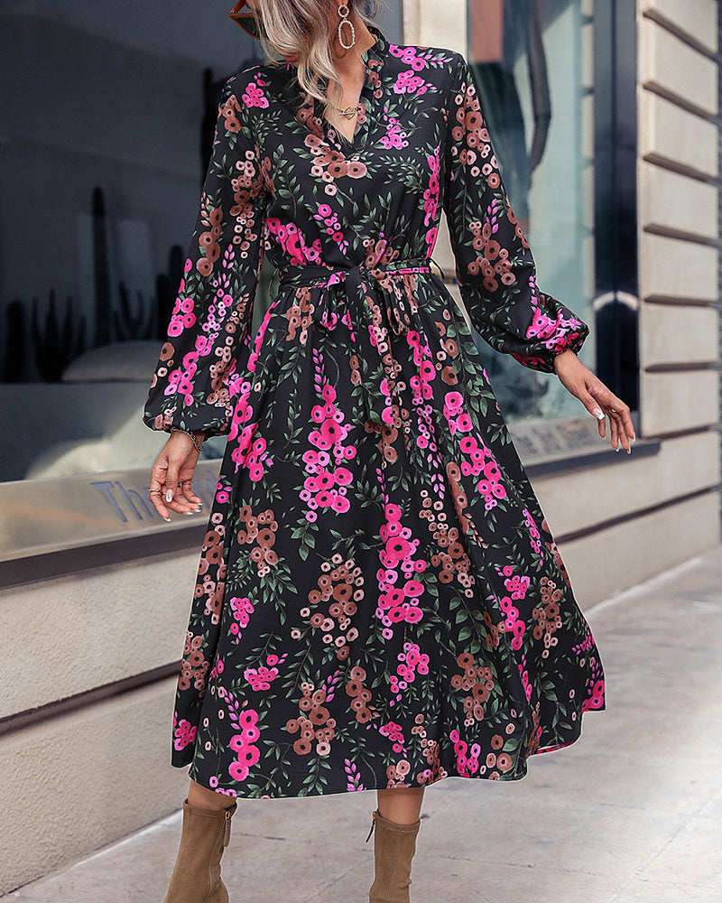 Elegant belted floral midi dress with V-neck and long sleeves for women