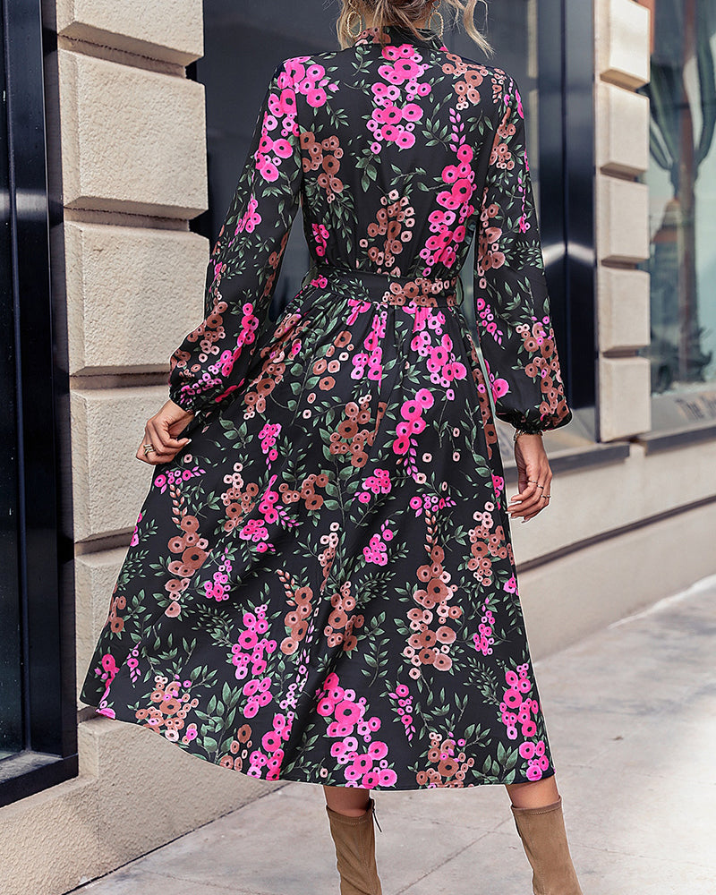 Elegant belted floral midi dress with V-neck and long sleeves for women